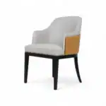 Elegant modern armchair with white upholstery, black wooden legs, and a gold accent on the side, perfect for stylish home or office decor.