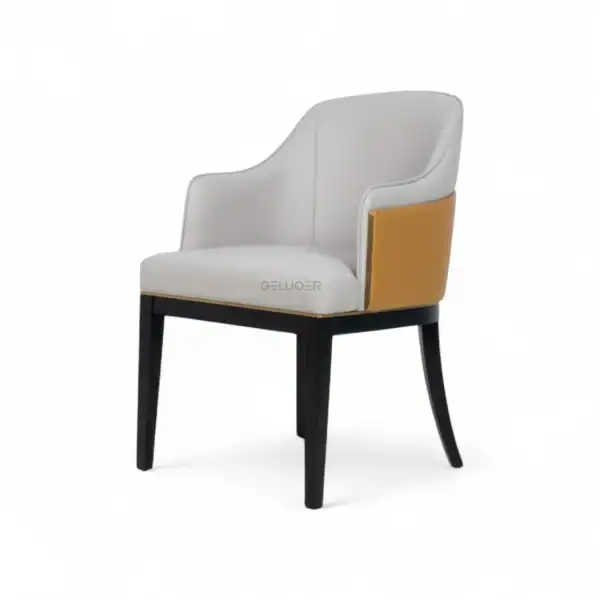 Elegant modern armchair with white upholstery, black wooden legs, and a gold accent on the side, perfect for stylish home or office decor.