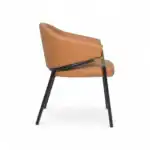 Contemporary beige leather accent chair with black and gold metal legs.