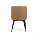 Elegant beige leather armchair with black and gold accented wooden legs by Geluoer Furniture.