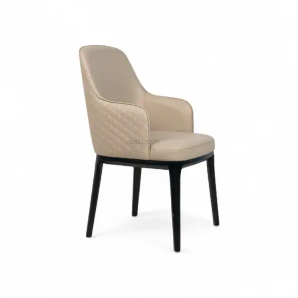 Luxurious beige leather dining chair with quilted backrest and black wooden legs.