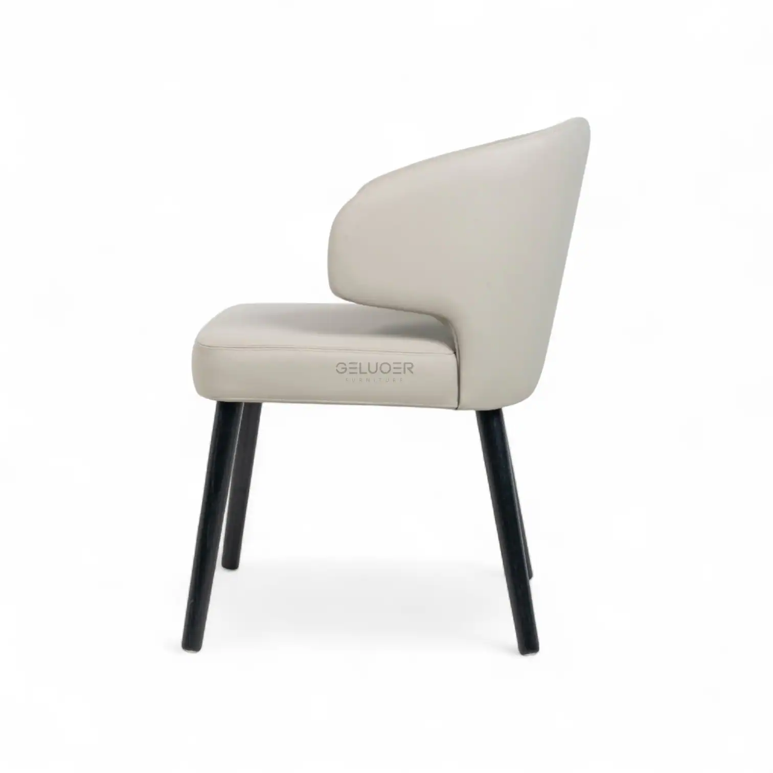 Comfortable modern accent chair with cream upholstery and black wooden legs.