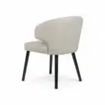 Comfortable beige upholstered dining chair with black wooden legs, modern furniture design.