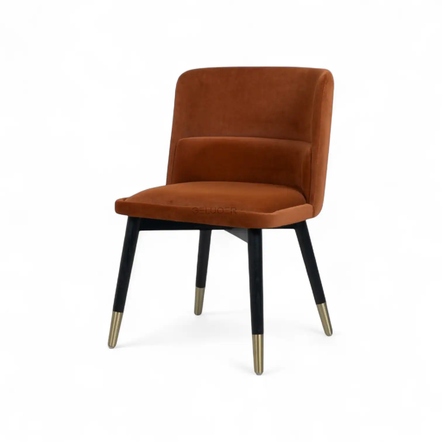 Stylish modern orange velvet lounge chair with black and gold legs for contemporary home decor.