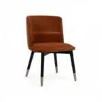 Elegant brown velvet dining chair with black and gold tapered legs, modern furniture design.