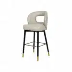 Elegant modern bar stool with beige cushioned seat and black gold-accented legs, perfect for stylish home bars or kitchens.