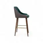 Elegant modern bar stool with wooden legs and cushioned seat, ideal for contemporary kitchen or bar area.