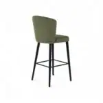 Luxury upholstered green bar stool with black metal legs and footrest for modern kitchens and bars.