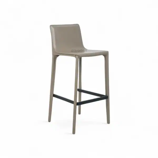 Luxury modern bar stool with beige leather seat and wooden legs, stylish furniture for kitchen or bar area.