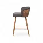 Luxurious modern bar stool with wood and leather accents, suitable for stylish home or restaurant decor.
