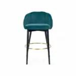 Luxurious teal velvet bar stool with black wooden legs and gold ring footrest. Modern, comfortable, and stylish furniture piece.