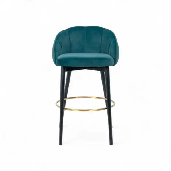 Luxurious teal velvet bar stool with black wooden legs and gold ring footrest. Modern, comfortable, and stylish furniture piece.