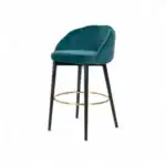 Luxurious teal velvet bar stool with black wooden legs and gold footrest for modern home bar decor.