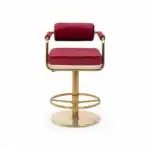 Luxurious pink velvet bar stool with gold metal frame, perfect for modern home or commercial decor.