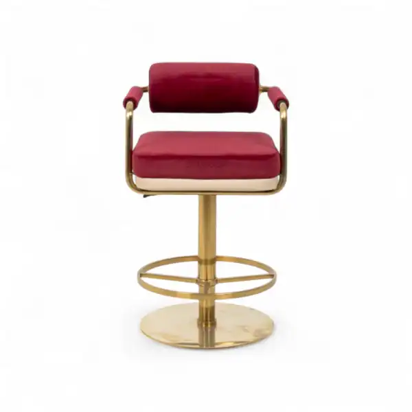 Luxurious pink velvet bar stool with gold metal frame, perfect for modern home or commercial decor.