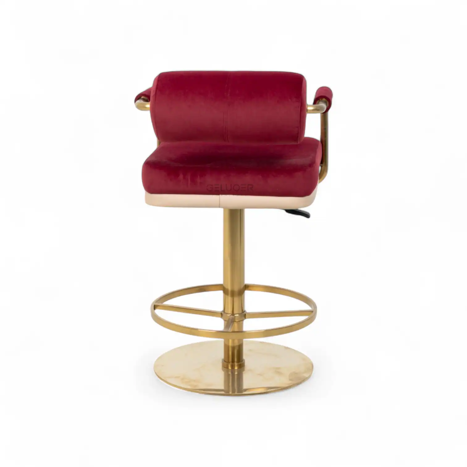 Luxurious red velvet bar stool with gold metal frame and footrest, stylish modern furniture for home bar.
