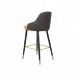 Contemporary bar stool with brown and orange cushioned seat, black wood legs, gold accents, modern furniture.