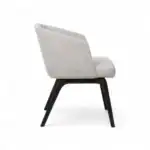 Comfortable modern lounge chair with beige upholstery and black wooden legs, ideal for stylish home decor.