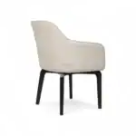 Luxurious beige upholstered armchair with black wooden legs, modern designer furniture piece.