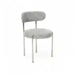 Modern upholstered dining chair with chrome frame and dotted fabric, stylish for contemporary home decor.