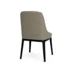 Modern beige quilted dining chair with black wooden legs from Geluoer Furniture.