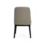 Stylish beige quilted dining chair with black wooden legs from Geluoer Furniture.