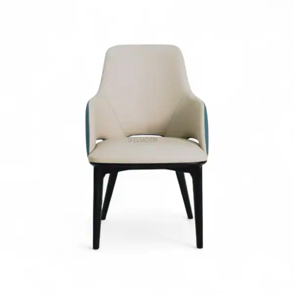Sleek modern armchair with cream upholstery and black wooden legs.