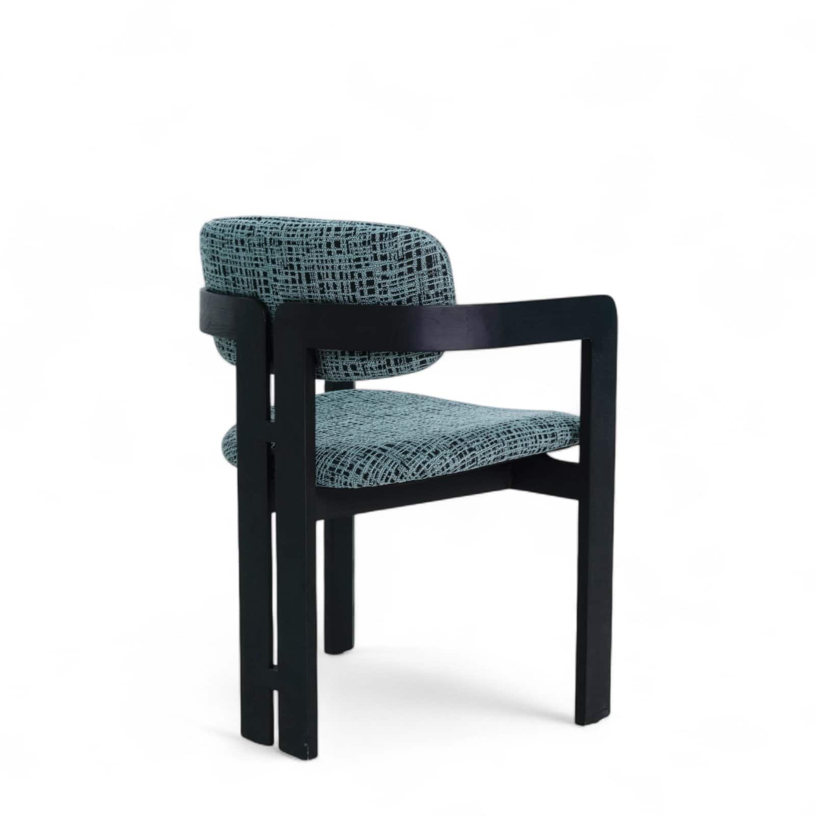 Contemporary designer chair with black wooden frame and patterned upholstery.