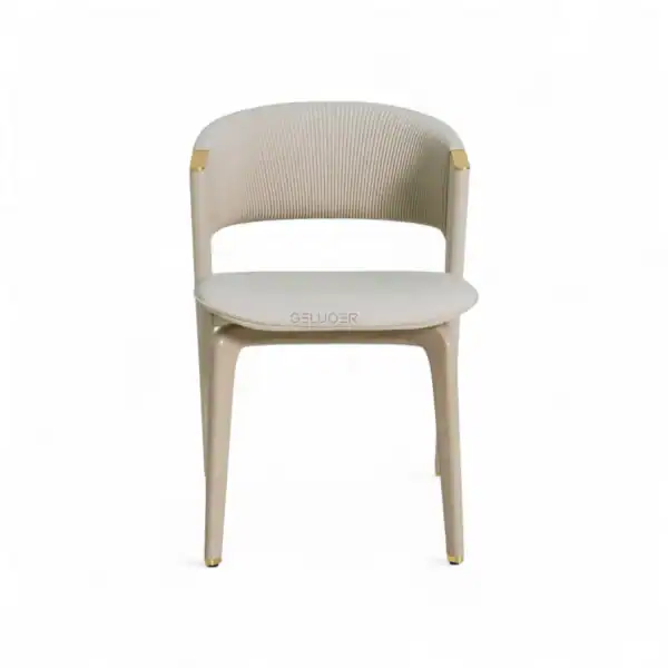 Luxury modern dining chair with ribbed backrest and gold accents for elegant home decor.