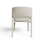Contemporary white armchair with textured backrest and wooden legs, ideal for modern living spaces.