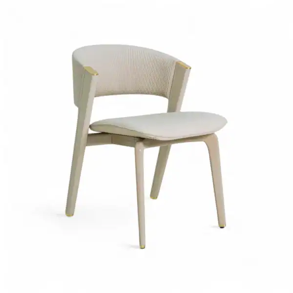 Elegant cream-colored modern dining chair with gold accents and comfortable upholstered backrest.