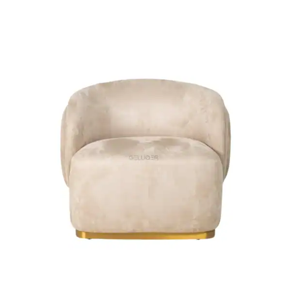 Luxurious beige velvet sofa with curved design and gold accent base for modern elegant living rooms.