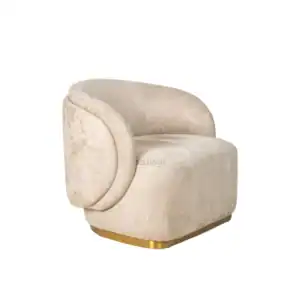 Luxurious cream velvet armchair with curved design and gold accent base.