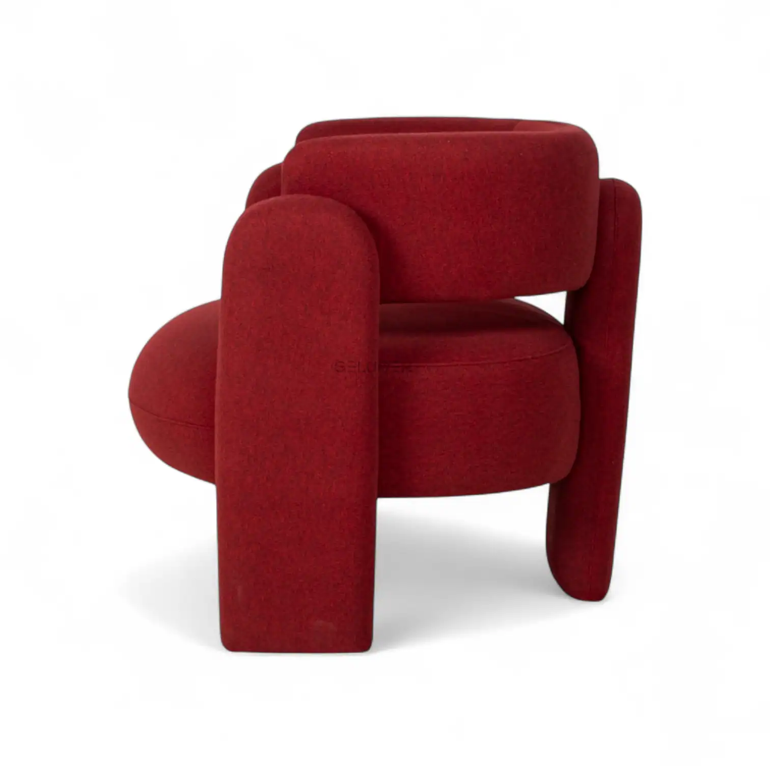 Red modern upholstered armchair for stylish living room decor.