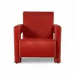 Elegant red leather armchair with nailhead trim for modern living room decor.