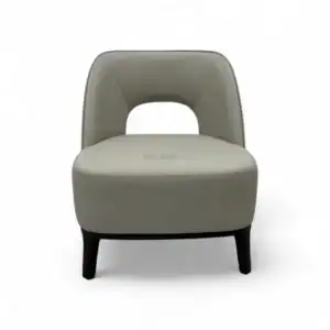 Contemporary grey upholstered armchair with black wooden legs, modern furniture design.