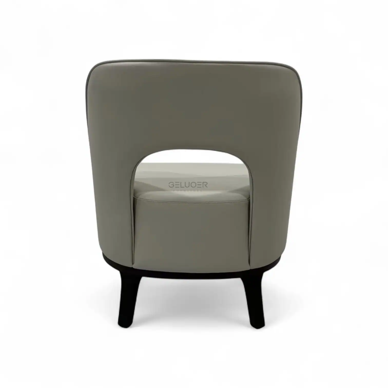 Contemporary grey leather armchair with unique cutout back design for modern living rooms.