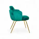 Luxurious turquoise velvet accent chair with gold metal legs, modern designer furniture piece.