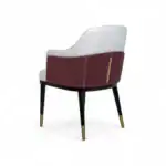 Luxurious upholstered armchair with modern design and gold accents, perfect for stylish home decor.