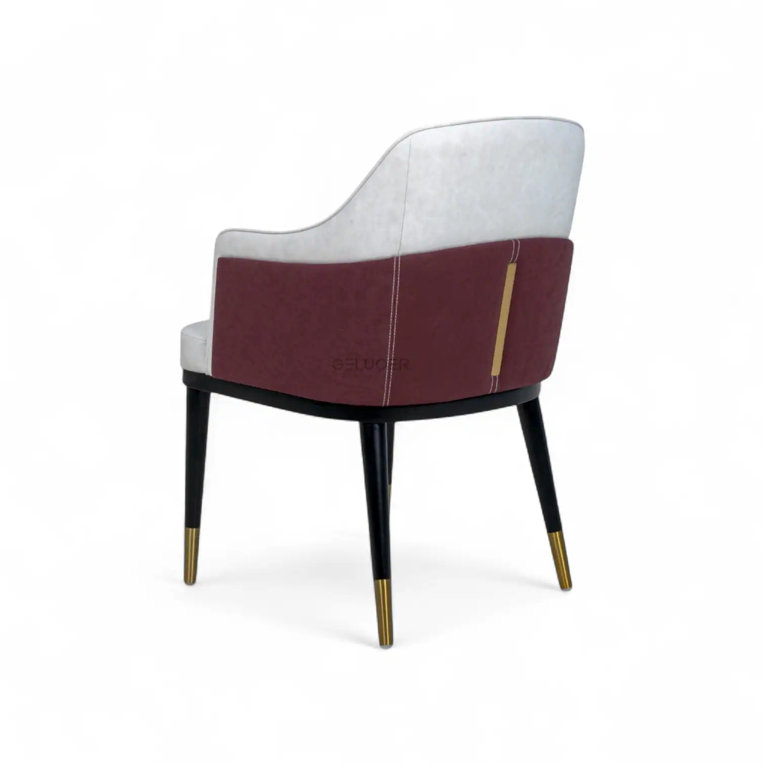 Luxurious upholstered armchair with modern design and gold accents, perfect for stylish home decor.