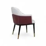Elegant modern armchair with white and maroon upholstery, stylish gold-tipped legs, perfect for contemporary home decor.