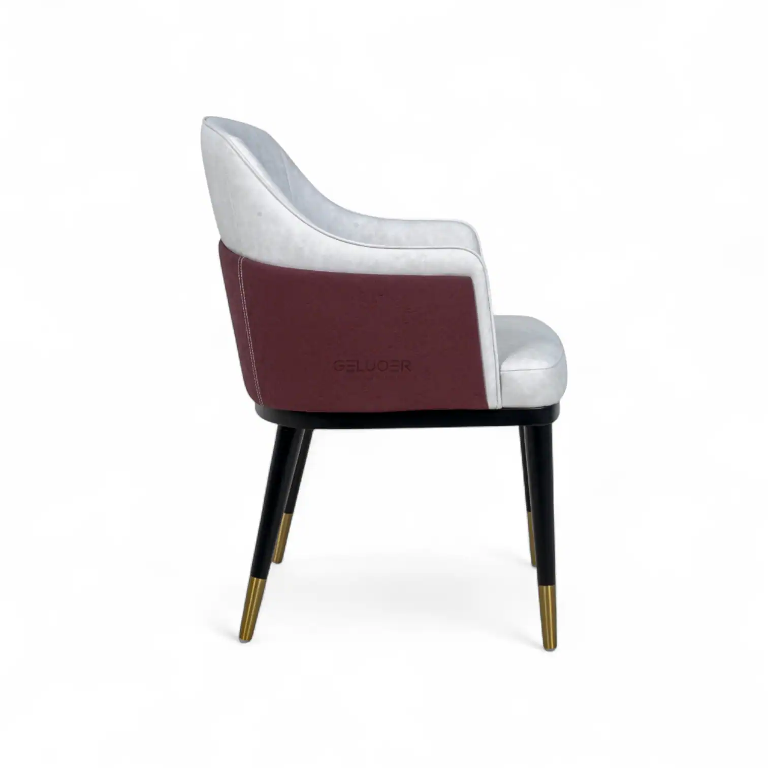 Luxurious modern accent chair with velvet upholstery and gold-tipped wooden legs.