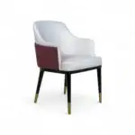 Luxurious modern dining chair with white and maroon upholstery, black legs with gold tips, perfect for stylish home decor.