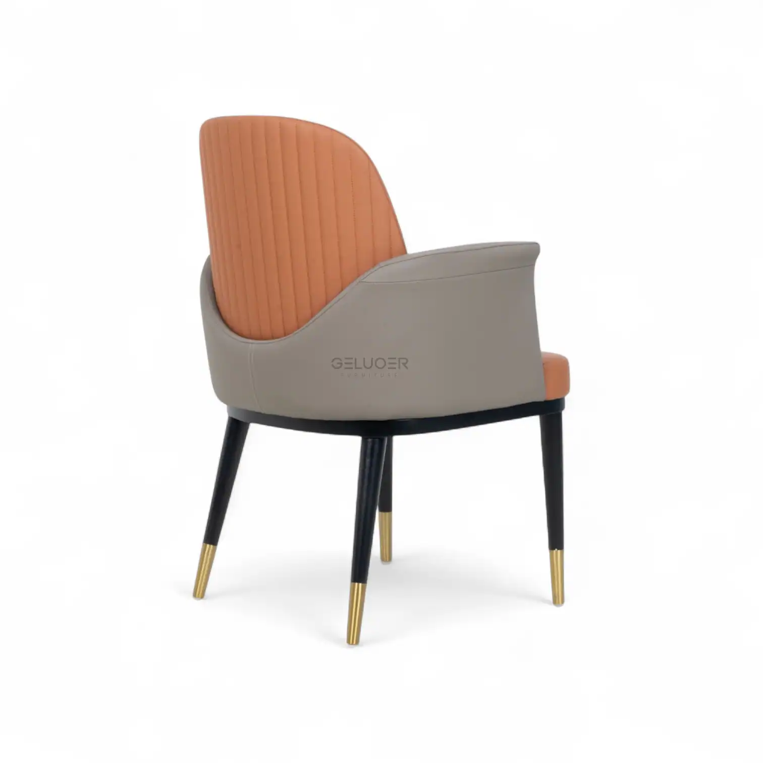 Luxurious modern accent chair with quilted upholstery and gold-tipped legs.