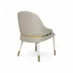 Luxurious beige upholstered chair with gold accents and tapered legs, perfect for elegant furniture decor.