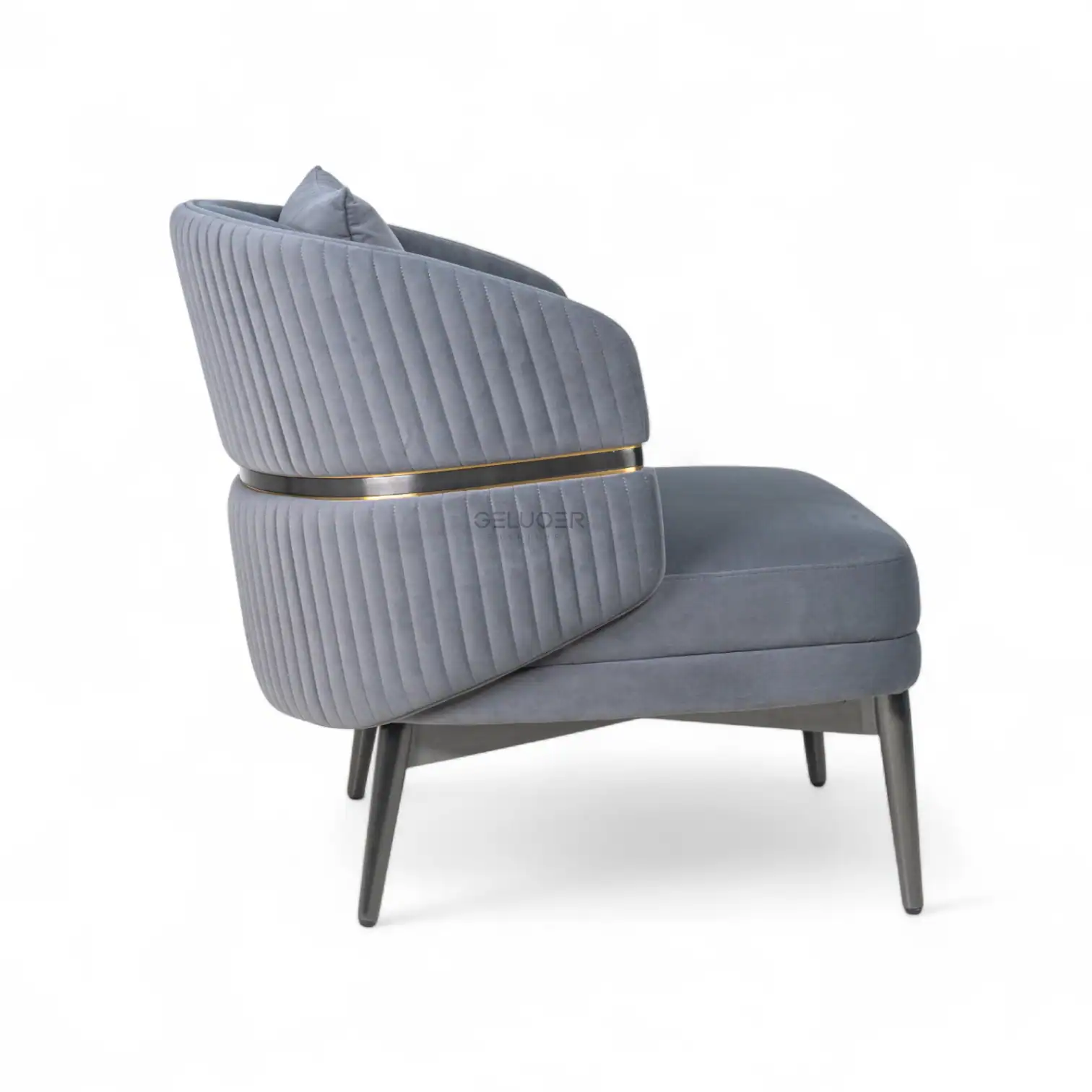 Grey velvet modern armchair with quilted backrest and wooden legs.