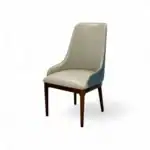 Stylish modern dining chair with wooden legs and upholstered leather seat for contemporary furniture design.