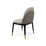 Elegant modern dining chair with beige and gray upholstery, black and gold tapered legs, perfect for sophisticated interior decor.