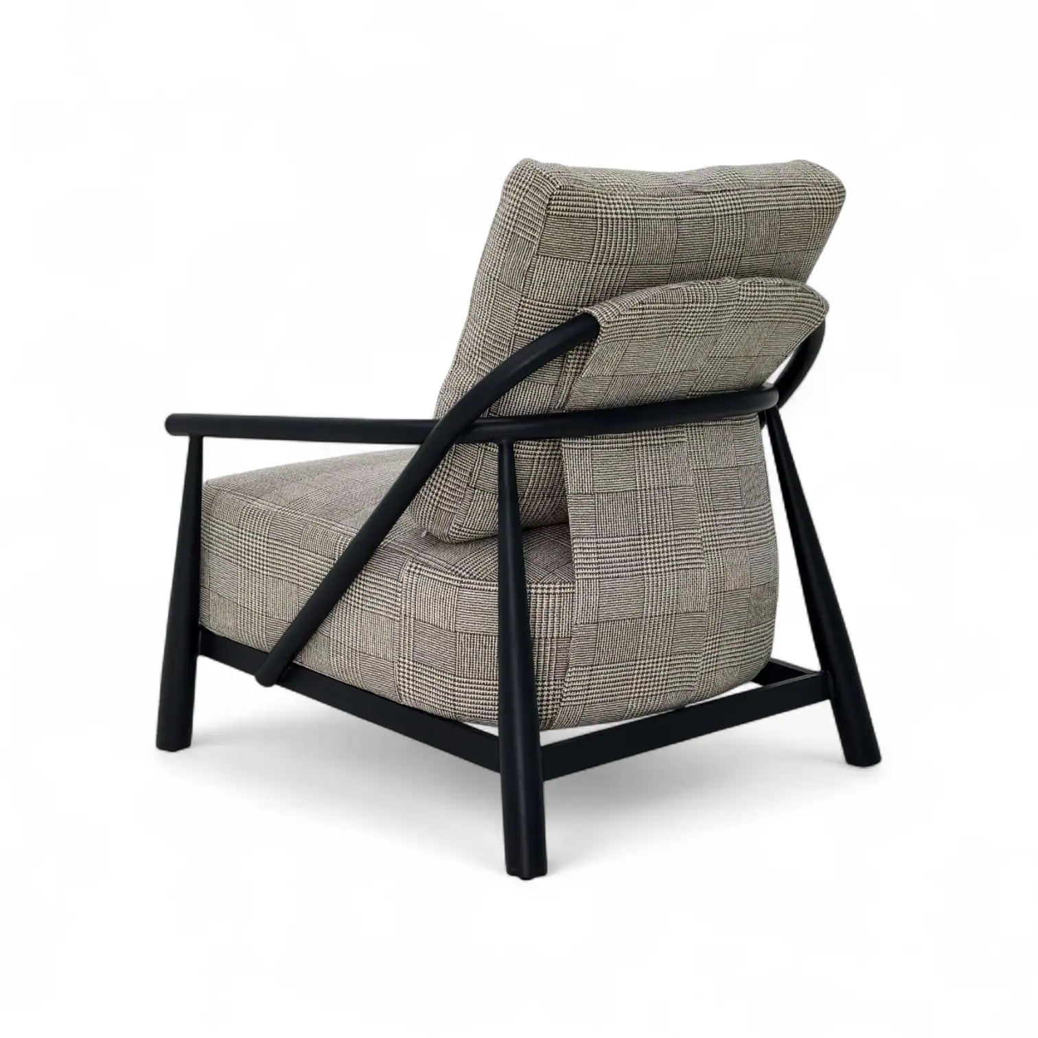 Comfortable modern armchair with plaid fabric and black wooden frame for stylish living room decor.