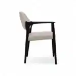 Sleek modern armchair with black wooden frame and white upholstered seat and backrest.